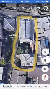 Satellite view of candidate land parcel in Japan with boundary marked for acquisition feasibility assessment
